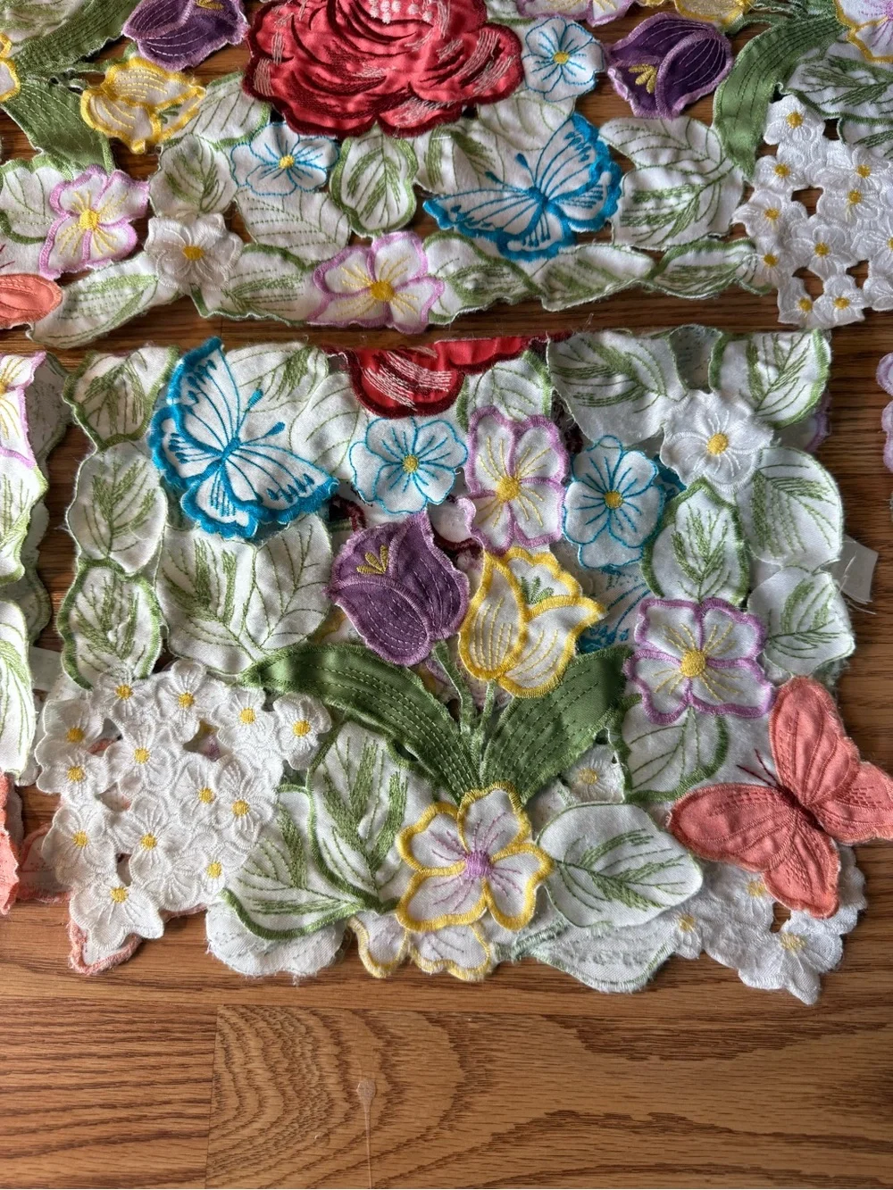 Vintage Set of Four multicolor embroidered floral & butterfly cutout placemats